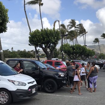 Leonard's Bakery Malasadamobile - With no seating area close by, feast off of the warm engine cover of your vehicle.  But never, never eat inside your car. - Food Trucks Near Me - Honolulu, Hawaii