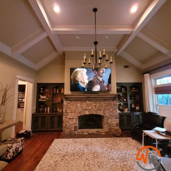 NuWave Automation - 75" TV installed above fireplace with new electrical outlet - Home Theatre Installation Near Me NuWave Automation - 75" TV installed above fireplace with new electrical outlet - Home Theatre Installation Near Me