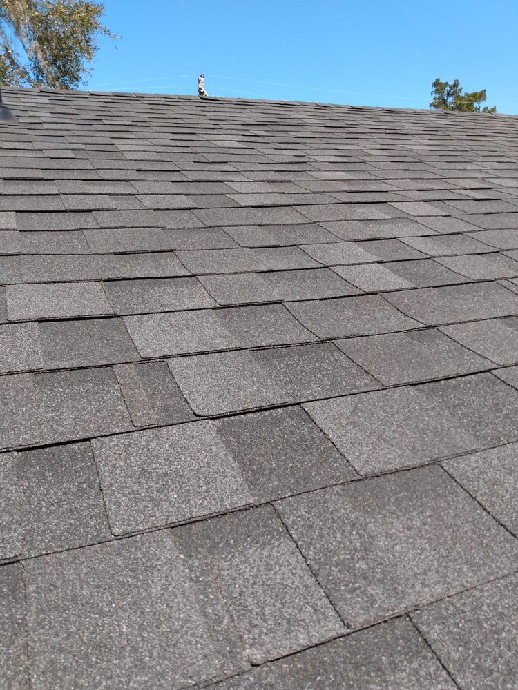 Slide of UnZucky Roofing