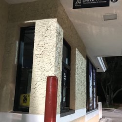 Hours on the left side and sign above say 24 hours
