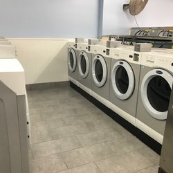 Quick Wash Laundromat - 10 double-load Crossover washers with high spin extract...will shorten time in the dryers.