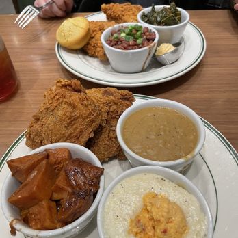 Fixins Soul Kitchen - Smothered chicken with gravy on the side. Candied yams and cheese grits.   Fried chicken, greens, and red beans and rice. - Soul Food Near Me - Tulsa, Oklahoma