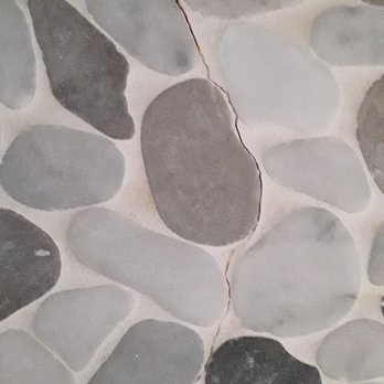 Re-Bath - a close up of a stone floor - General Contractors Near Me - Fort Myers, Florida Re-Bath - a close up of a stone floor - General Contractors Near Me - Fort Myers, Florida