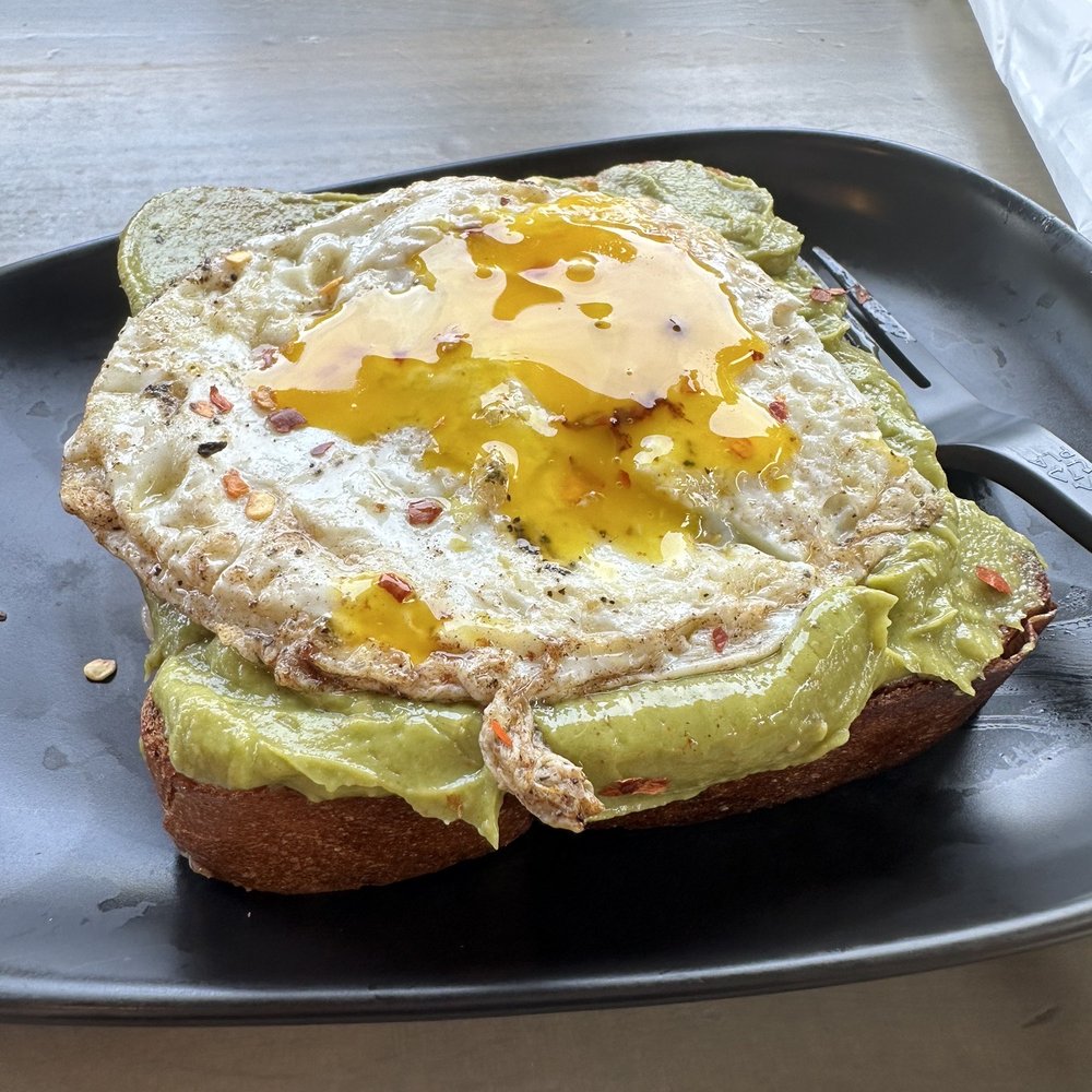 Reyna's Espresso & Sweets - Avocado toast with sunny side up egg - Cafes Near Me - Lawrenceville, Georgia Reyna's Espresso & Sweets - Avocado toast with sunny side up egg - Cafes Near Me - Lawrenceville, Georgia