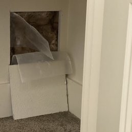 a hole in the wall of a bathroom