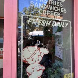 Exterior outside entrance of Milk Belly Bakery - Front window - San Jose, California Exterior outside entrance of Milk Belly Bakery - Front window - San Jose, California