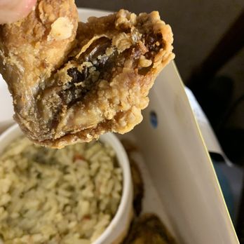 Bojangles - a hand holding a piece of fried food - Fast Food Near Me - Greensboro, North Carolina Bojangles - a hand holding a piece of fried food - Fast Food Near Me - Greensboro, North Carolina