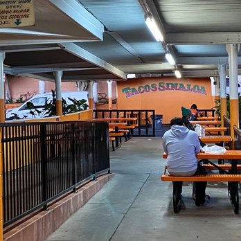 Tacos Sinaloa - two people sitting at a table - Food Trucks Near Me - Oakland, California Tacos Sinaloa - two people sitting at a table - Food Trucks Near Me - Oakland, California