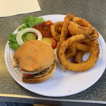Weezy's - a hamburger and onion rings on a plate - Bars Near Me - Hamel, Illinois