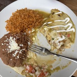 Green enchilada, half eaten because it was HORRIBLE... Green enchilada, half eaten because it was HORRIBLE...