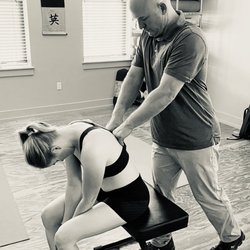 The Nature Gallery Yoga & Massage Studio - Jason Watford Structural Integrator works the back muscles to enhance the clients movement and function.