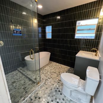 Shining Stone Granite and Tile - Finished Green Bathroom with Italian hand glazed tiles and hexagon green marble flooring. - Countertop Installation Near Me Shining Stone Granite and Tile - Finished Green Bathroom with Italian hand glazed tiles and hexagon green marble flooring. - Countertop Installation Near Me