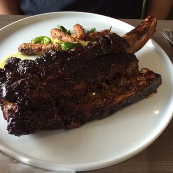 Weights + Measures - Beef Rib with garlic polenta and grilled baby carrots - Bars Near Me - Houston, Texas Weights + Measures - Beef Rib with garlic polenta and grilled baby carrots - Bars Near Me - Houston, Texas
