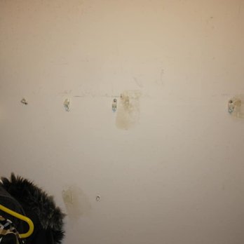Jazzy's Handyman Services - Before. Wall with no shelf. Just holders, screws, and holes. - Handyman Near Me