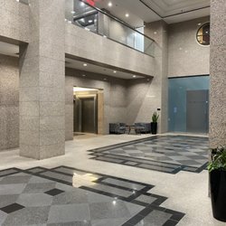 The Health Collective - Main building lobby leading to elevators, bathrooms, and snack bar