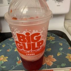7-Eleven - Slurpee Cherry 30oz with straw. My favorite drink!