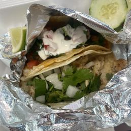 Tacos: chicken dressed Guadalajara style and birria dressed supreme style. Tacos: chicken dressed Guadalajara style and birria dressed supreme style.