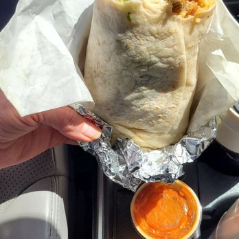 Tacos El Primo - Carnitas Burrito with green and red salsa (red has a big kick if you like hot salsa). - Mexican Near Me - Sanford, North Carolina Tacos El Primo - Carnitas Burrito with green and red salsa (red has a big kick if you like hot salsa). - Mexican Near Me - Sanford, North Carolina