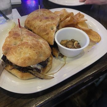 Galati's Hideaway - One of the specials today. Philly steak sandwich with melted mozzarella, mushrooms on toasted ciabatta bread. Potato chips tasted homemade. - Italian Near Me - Cary, Illinois
