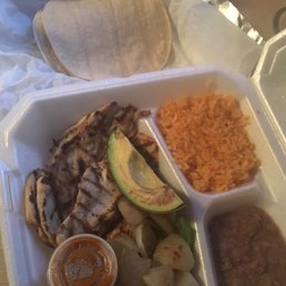 $12 grilled chicken plate. Tiny amounts of rice and beans.