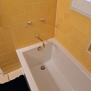 Pacific Coast Tile Installation - New yellow tile with white edging around the tub - Tiling Near Me Pacific Coast Tile Installation - New yellow tile with white edging around the tub - Tiling Near Me