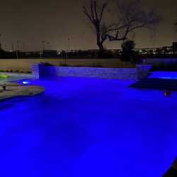 Extreme Backyard Pools and Spas - Pool at night. No ones lights illuminate like ours! Call us for the deepest color at night. :)