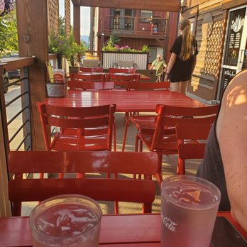 Sawmill Grille & Spirits - a red table and red chairs - American Near Me - Post Falls, Idaho Sawmill Grille & Spirits - a red table and red chairs - American Near Me - Post Falls, Idaho