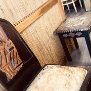 Photo of Zeni Ethiopian Restaurant - San Jose, CA, United States. Artwork on furniture