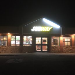 the entrance of a subway restaurant at night the entrance of a subway restaurant at night