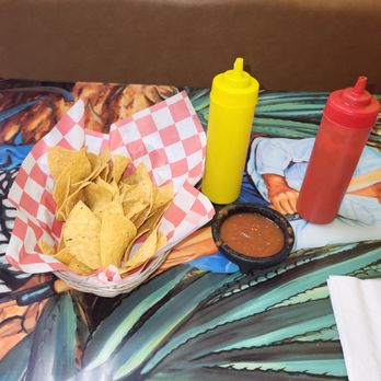 Taqueria El Tapatio - a table with chips and condiments - Mexican Near Me - Lancaster, Ohio Taqueria El Tapatio - a table with chips and condiments - Mexican Near Me - Lancaster, Ohio