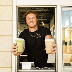 Joe handing drinks out the drive-thru window