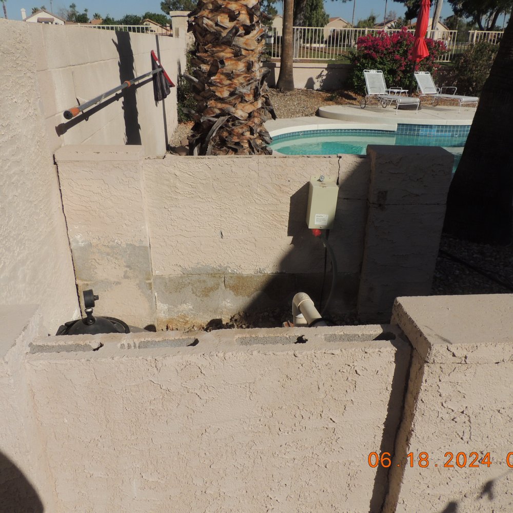 DIGN Homes - Brick wall enclosure BEFORE being rebuilt. - Roofing Near Me