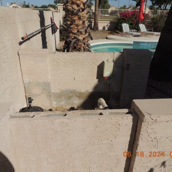 DIGN Homes - Brick wall enclosure BEFORE being rebuilt. - Roofing Near Me