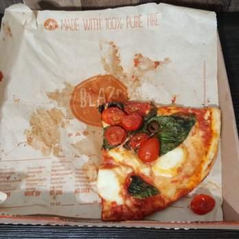 Blaze Pizza - Recooked pizza. Notice the thin, runny sauce still on the wrapper. Oh, and say hi to the huddled cherry tomatoes when you see them! - Salad Near Me - Amherst, New York Blaze Pizza - Recooked pizza. Notice the thin, runny sauce still on the wrapper. Oh, and say hi to the huddled cherry tomatoes when you see them! - Salad Near Me - Amherst, New York