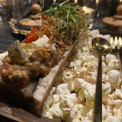 Pretty to Think So - Roasted Bone Marrow + Beef Tartare $22 caper + gerkin remoulade, potato crisps, black garlic aioli, grated horseradish