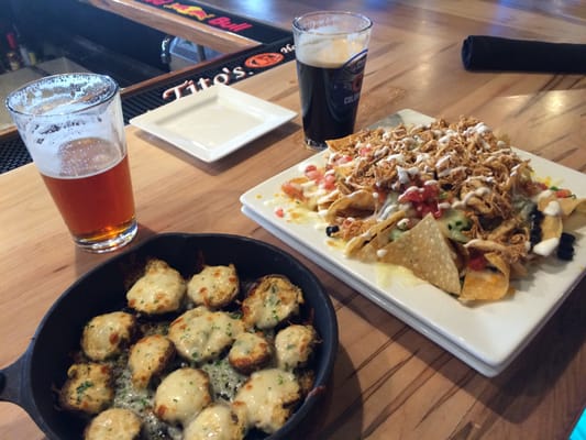 Photo of Summit House Grill and Tap - Lakewood, CO, US. Cheese/Mushrooms and Chicken Nachos at the bar