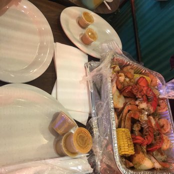 Puerto Plata Fish Market - Their signature hot sauce and Fulton Tray - Seafood Markets Near Me - Brooklyn, New York