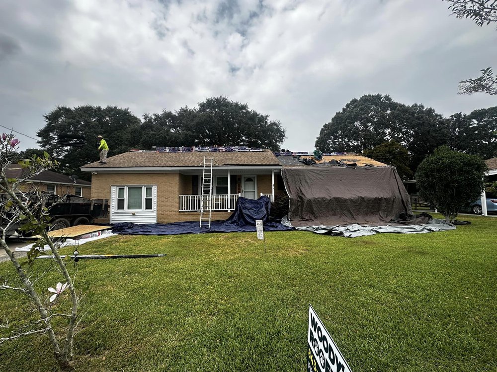 Slide of Woody's Roofing