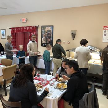 Addis Ababa - Ethiopian Restaurant - a group of people eating - Ethiopian Near Me - Rochester, New York Addis Ababa - Ethiopian Restaurant - a group of people eating - Ethiopian Near Me - Rochester, New York
