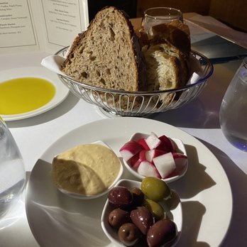 Varka Estiatorio - Complimentary bread with hummus, radishes, olives and olive oil - Greek Near Me - Ramsey, New Jersey Varka Estiatorio - Complimentary bread with hummus, radishes, olives and olive oil - Greek Near Me - Ramsey, New Jersey