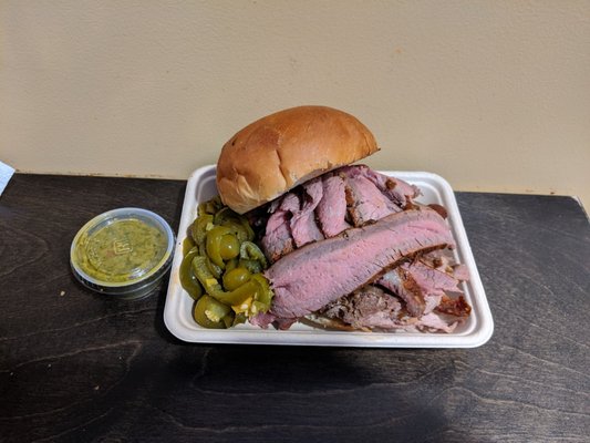 Photo of The Pig’s Gig BBQ - San Diego, CA, US. The Headliner! Tri-tip, pulled pork and hot link sandwich with a side of jalapenos and chimichurri sauce. Delicious!