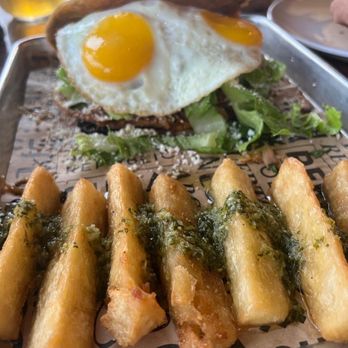 Sofrito Latin Cafe - Patacon with fried yuca and eggs sunny side up - Latin American Near Me - Orlando, Florida Sofrito Latin Cafe - Patacon with fried yuca and eggs sunny side up - Latin American Near Me - Orlando, Florida