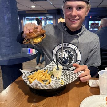 Boro Bar & Grill - Riverview - Pretzel roll with chicken and mustard, fries on the side. - Sports Bars Near Me - Harrisburg, Pennsylvania Boro Bar & Grill - Riverview - Pretzel roll with chicken and mustard, fries on the side. - Sports Bars Near Me - Harrisburg, Pennsylvania