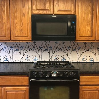 Tile and Trowel - Glass mosaic tile blacksplash overview, over range. - Tiling Near Me