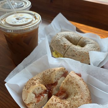 Laurel Street Bakery - Sesame bagel with cream cheese and strawberry jelly; cinnamon raisin bagel with egg, bacon, and cheese in the back; iced coffee; mocha - Bakeries Near Me - New Orleans, Louisiana Laurel Street Bakery - Sesame bagel with cream cheese and strawberry jelly; cinnamon raisin bagel with egg, bacon, and cheese in the back; iced coffee; mocha - Bakeries Near Me - New Orleans, Louisiana