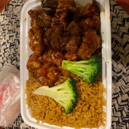 Orange chicken and plain fried rice. Orange chicken and plain fried rice.