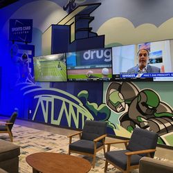 CardsHQ - Comfy lounge area with TVs