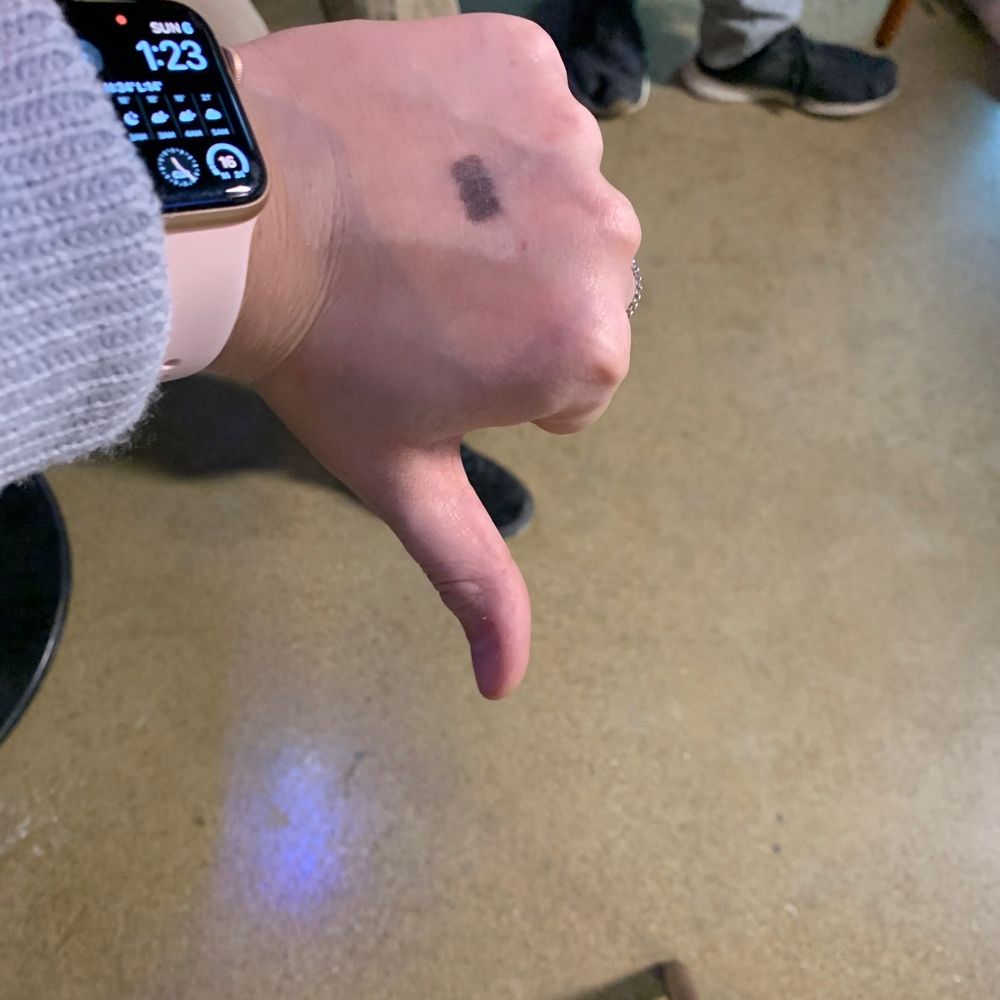 a hand with a wrist tattoo