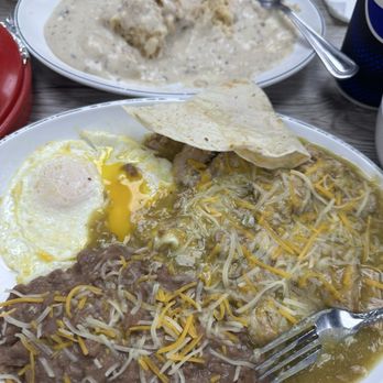 Gus Restaurant - Burrito plated with two eggs over easy.  Biscuits gravy - Breakfast & Brunch Near Me - Bakersfield, California