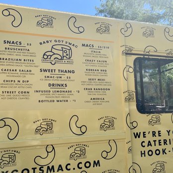 Baby Got S'Mac - a woman looking out the window of a food truck - Food Trucks Near Me - Fort Wayne, Indiana